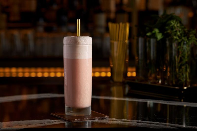 Pink cocktail in highball glass