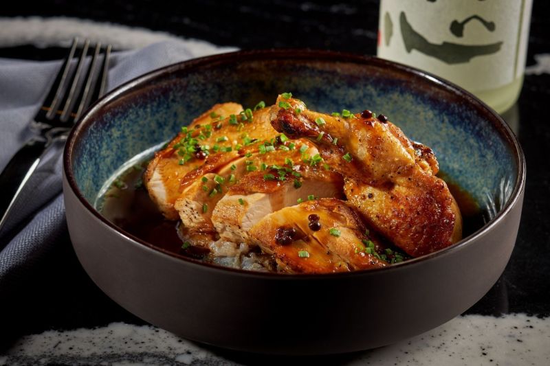 Chicken dish in a round blue bowl 