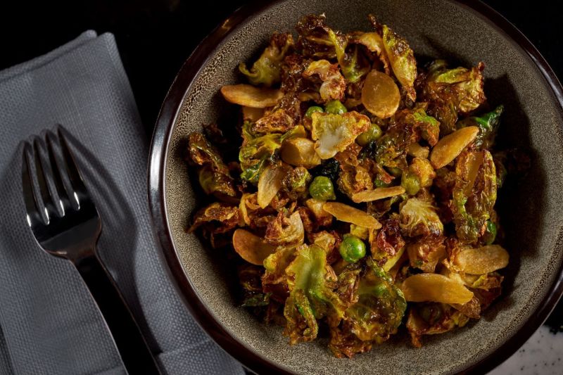 Food in round bowl with black fork