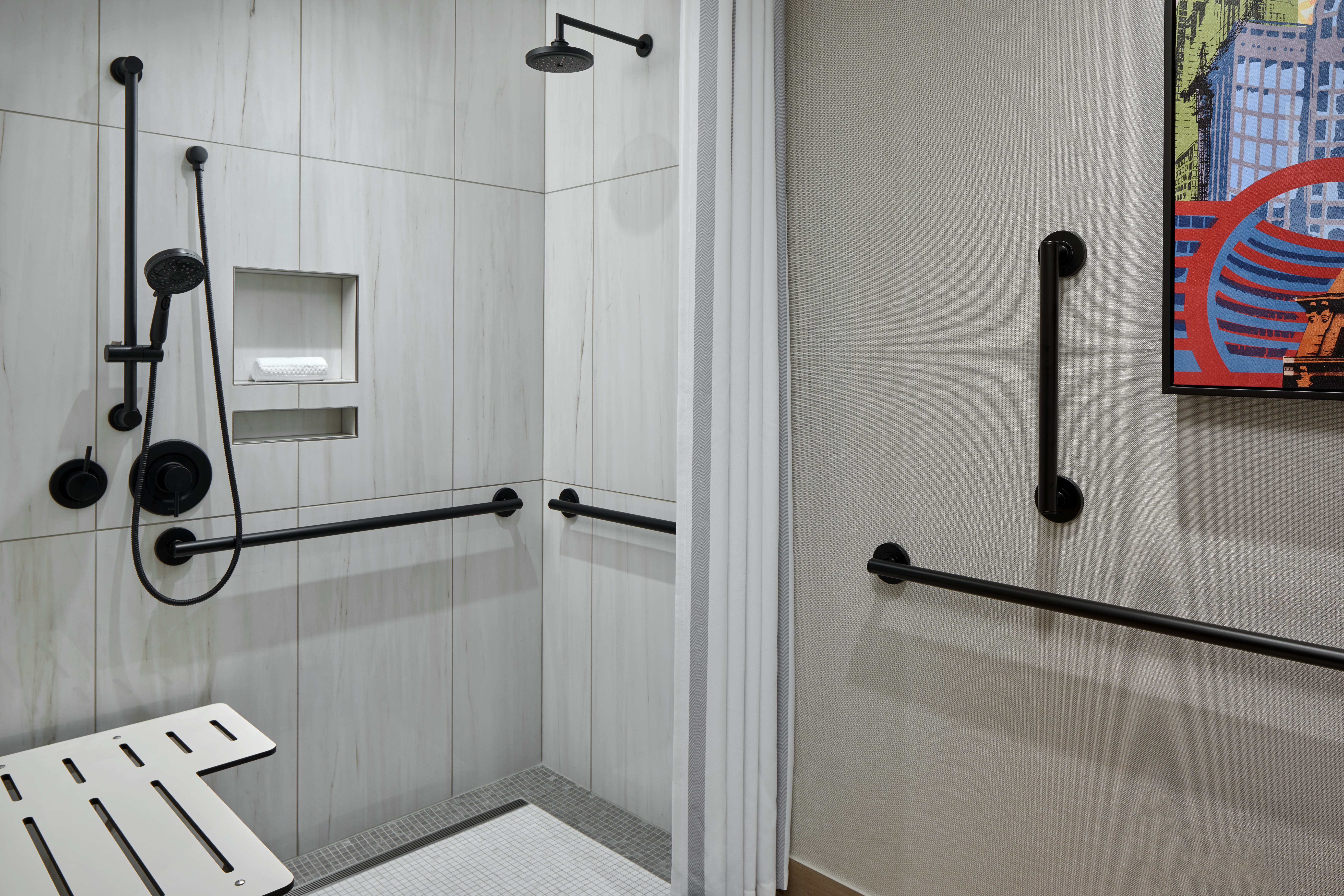 Walk in shower in bathroom of Watermark Hotel.